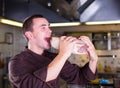 Chef eating a big piese of raw meat Royalty Free Stock Photo