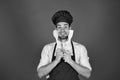 Chef with excited face holds wooden spoon and spatula Royalty Free Stock Photo