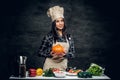 Chef female holds punmping. Royalty Free Stock Photo