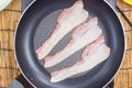 Chef frying bacon in the pan Royalty Free Stock Photo