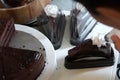 Chef garnish chocolate cake with cream