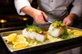 a chef garnishing baked cod with lemon slices