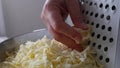 Chef grating cheese for pizza, close up. Royalty Free Stock Photo
