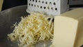 Chef grating cheese for pizza, close up Royalty Free Stock Photo