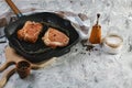 Chef grilled pork steak in a pan with rosemary and spices. Copy text