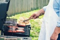 A chef grilling food outside
