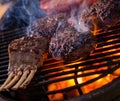 Chef grilling ribs in a restaurant Royalty Free Stock Photo