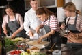 Chef and group of young people during cooking classes Royalty Free Stock Photo