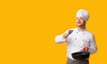 Chef Guy Holding Pan Throwing Invisible Food Standing, Studio Shot