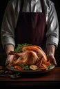 Chef hand holding a platter with a roasted turkey.