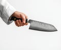 chef hand holding sharp kitchen knife, showcasing its sleek design and sharp blade. image conveys precision and culinary skill, Royalty Free Stock Photo
