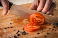 Chef Hand and Knife Slicing Tomato Royalty Free Stock Photo