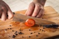 Chef Hand and Knife Slicing Tomato Royalty Free Stock Photo