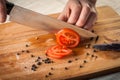 Chef Hand and Knife Slicing Tomato Royalty Free Stock Photo