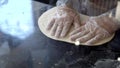 Chef hand use wood rolling thresh pizza flour Italian homemade pizzeria