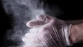 Chef Hands Clapping With Flour In Slow Motion on black background. Frame. Chef Claps Hands Together With Flour, Super Royalty Free Stock Photo