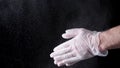 Chef Hands Clapping With Flour In Slow Motion on black background. Frame. Chef Claps Hands Together With Flour, Super Royalty Free Stock Photo