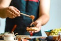 Chef hands cooking bruschetta with goat cheese, figs, Honey. concept of Italian cuisine