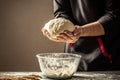 Chef hands cooking dough on dark wooden background. space for text Royalty Free Stock Photo
