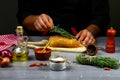 Chef hands cooking meat steak, herbs and spices on wooden background. Food concept Royalty Free Stock Photo