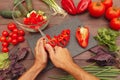 Chef hands cut fresh bellpepper for salad on wooden table Royalty Free Stock Photo