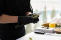 Chef Hands Cutting Dieting Tropical Fruit Avocado. Man Chopping Exotic Ingredient with Sharp Knife on Cutting Board.