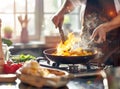 Chef hands keep wok with fire. Closeup chef hands cook food with fire. Chef man burn food at professional kitchen. Royalty Free Stock Photo