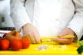 Chef hands with pasta en vegetables