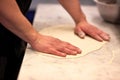 Chef hands preparing dough on table at kitchen Royalty Free Stock Photo