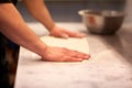 Chef hands preparing dough on table at kitchen Royalty Free Stock Photo