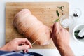 Chef hands with raw meat pork roast cooking preparation