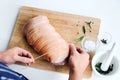 Chef hands with raw meat pork roast cooking preparation