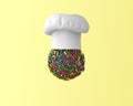 Chef hat with chocolate sweets concept on pastel yellow background. minimal idea food and fruit concept. Idea creative to produce