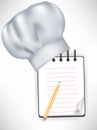 Chef hat with recipe notebook Royalty Free Stock Photo