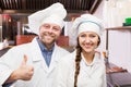 Chef and his helper at bistro kitchen Royalty Free Stock Photo