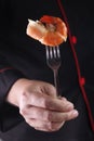 Chef hold fork with big shrimp