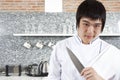 Chef hold a knife. Royalty Free Stock Photo