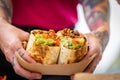 The chef is holding a burrito, close up Royalty Free Stock Photo