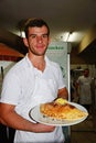 Chef holding a Calzone, Hersonissos.