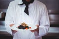 Chef holding a dish with spaghetti Royalty Free Stock Photo