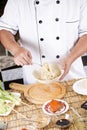 Chef holding the noodle from the bowl with fork Royalty Free Stock Photo