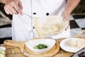 Chef holding the noodle from the bowl with fork Royalty Free Stock Photo