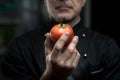 Chef holding a tomato