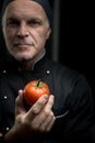 Chef holding a tomato