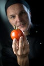 Chef holding a tomato