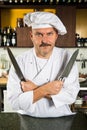 Chef holding two knives