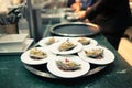 Chef in hotel or restaurant kitchen cooking and decorating food for dinner Royalty Free Stock Photo