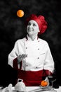 Chef juggling with orange Royalty Free Stock Photo