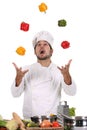 Chef juggling with peppers Royalty Free Stock Photo