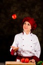 Chef juggling with tomato Royalty Free Stock Photo